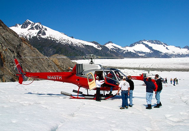 helicopter landing on glacier